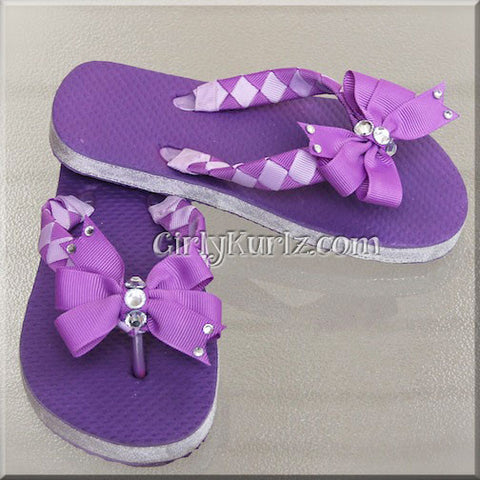 purple woven flip flops