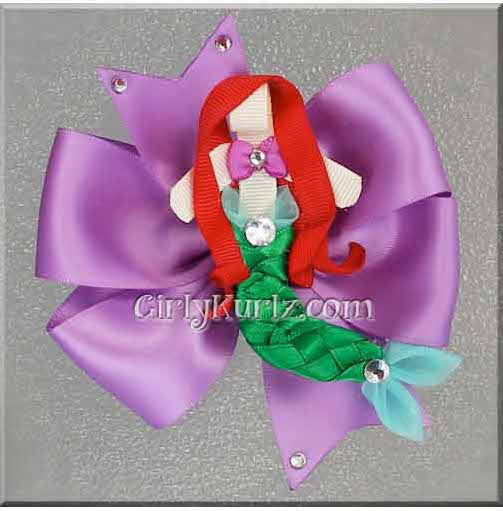 Boutique-style purple and green bow with mermaid-inspired character ribbon clip